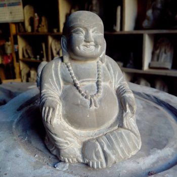 stone craving laughing buddha